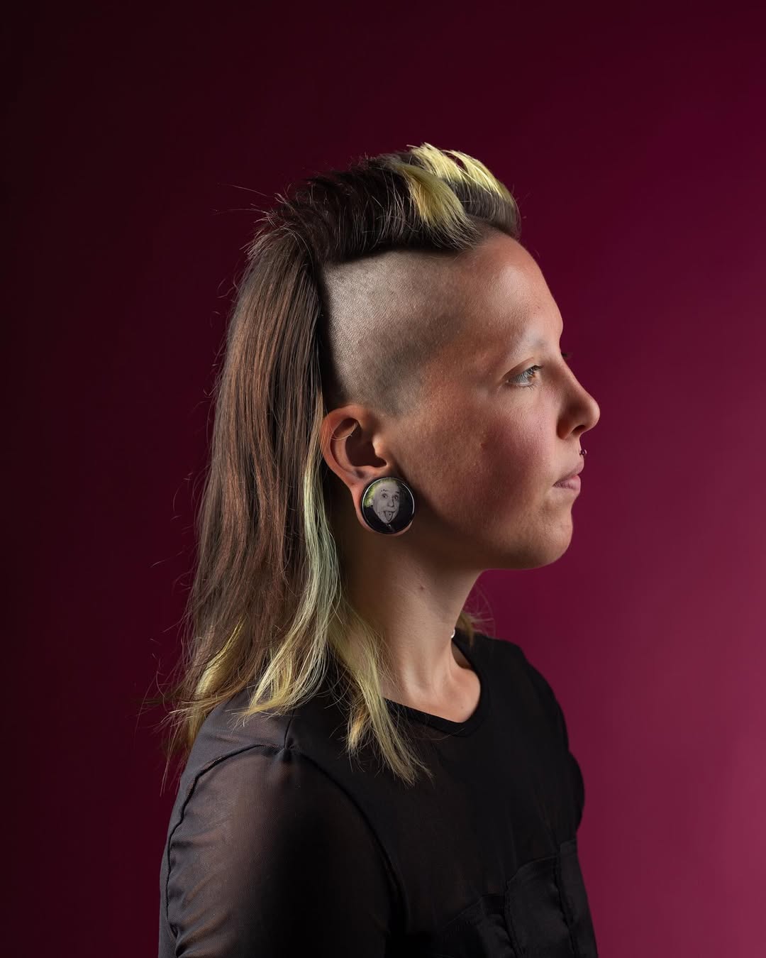 Bold Undercut With Striking Neon Green Streaks