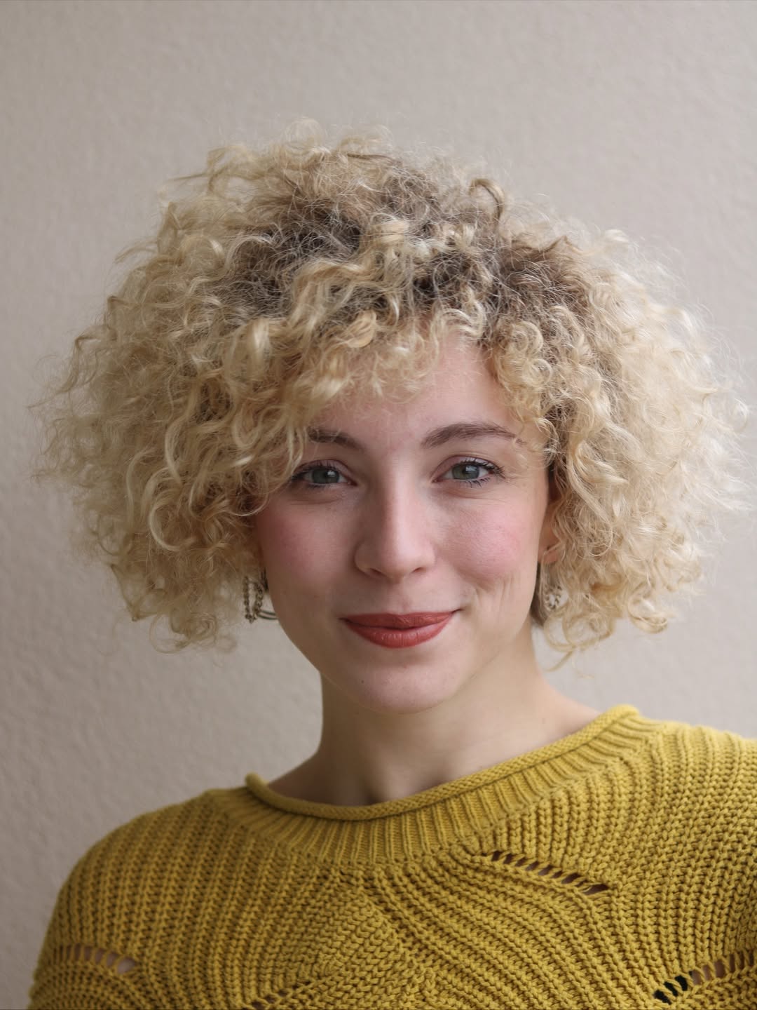 Bouncy Blonde Curly Bob With Wispy Bangs