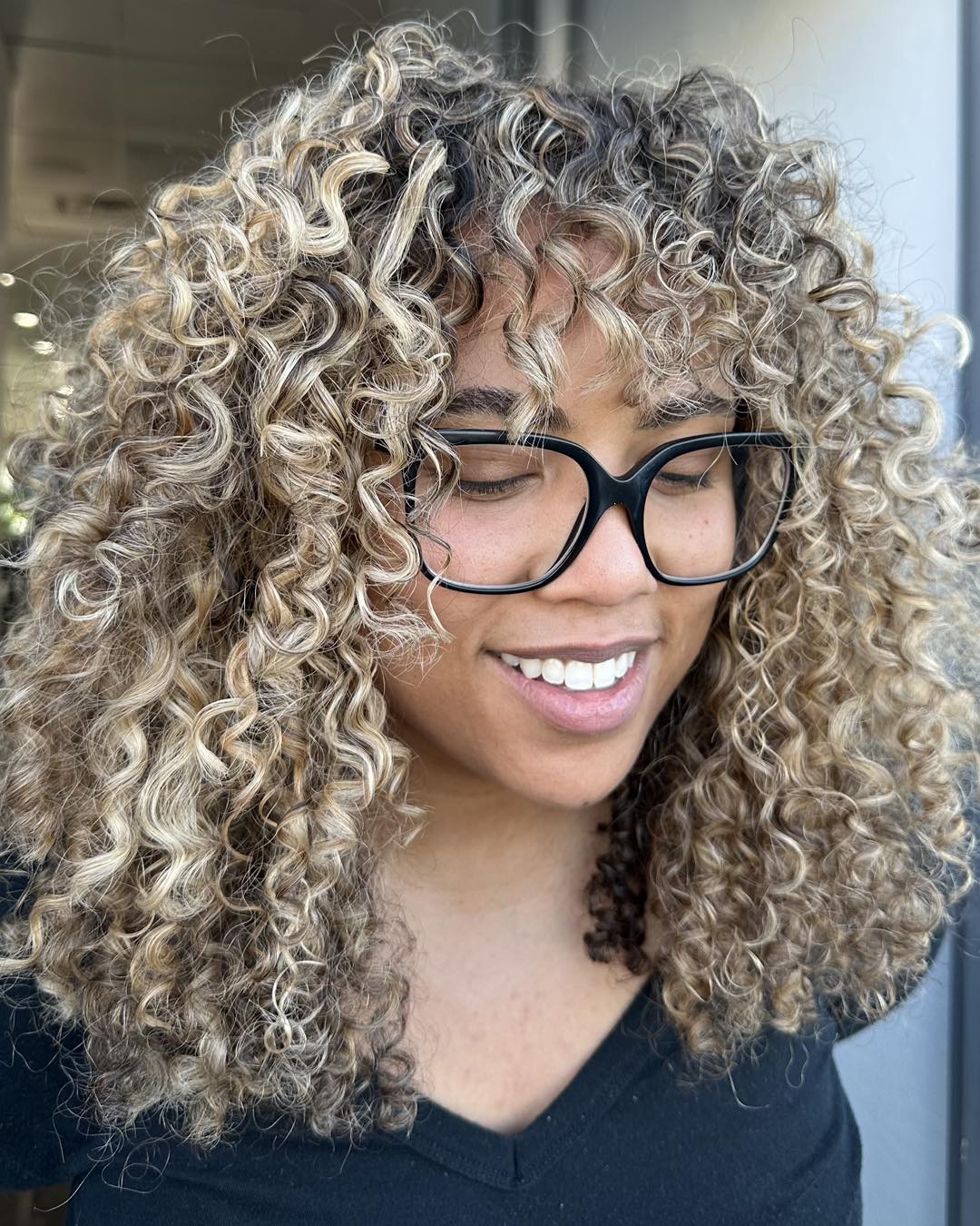 Bouncy Blonde Highlights With Curly Fringe