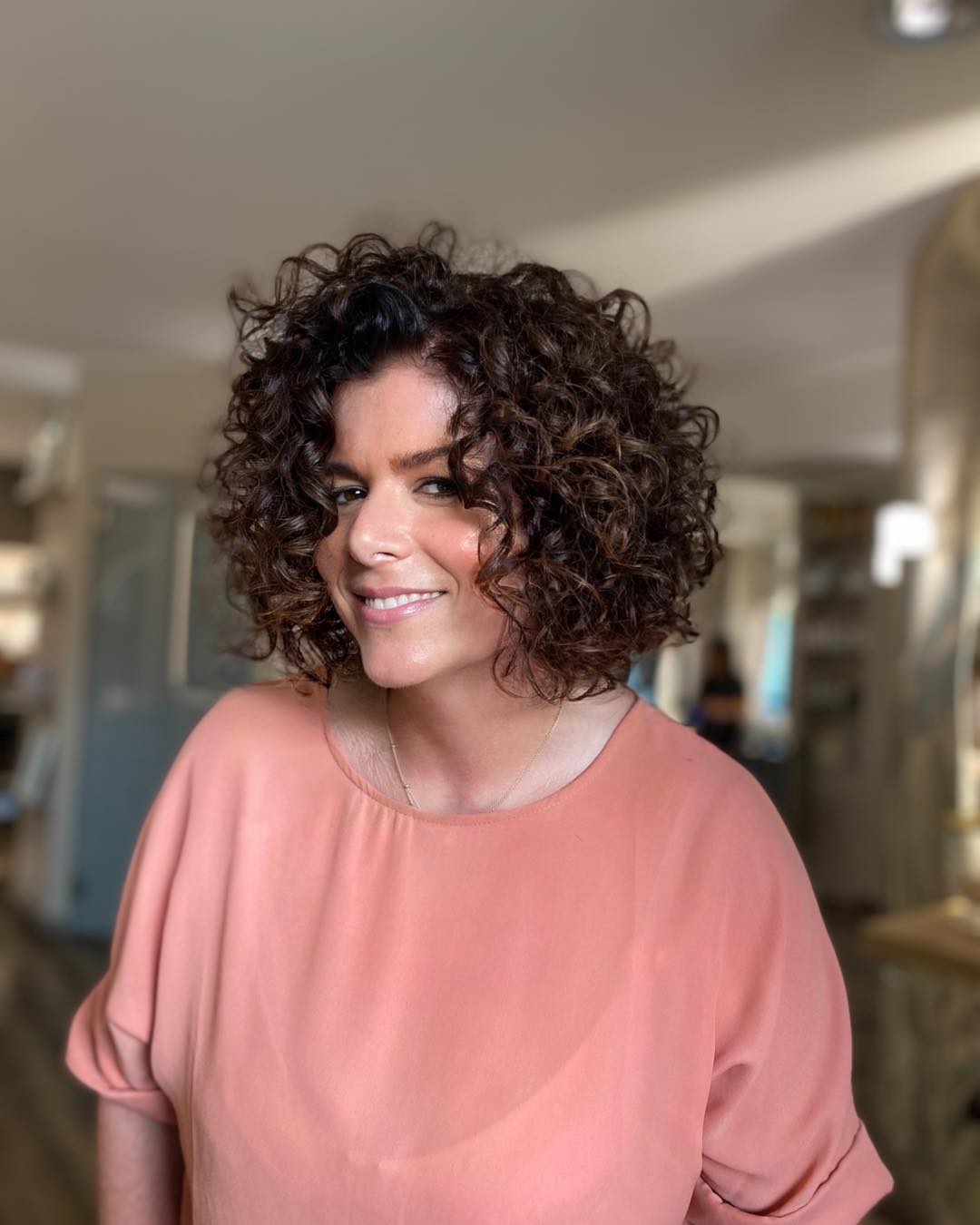 Bouncy Brown Curly Bob With Side Part