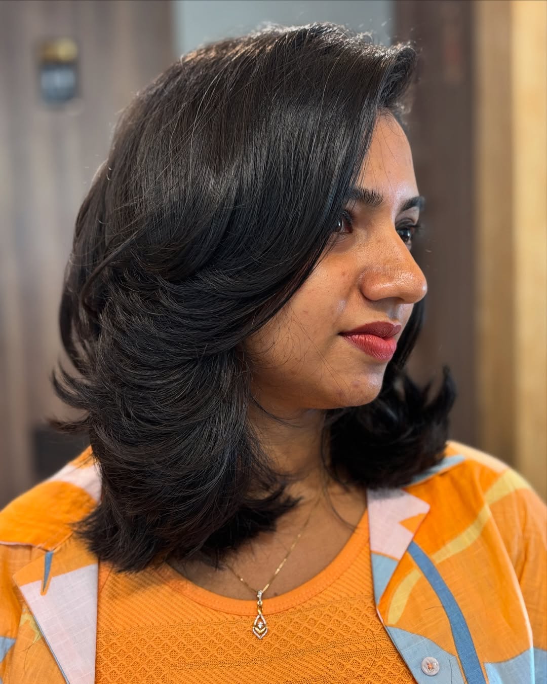 Bouncy Layered Black Bob With Side Part
