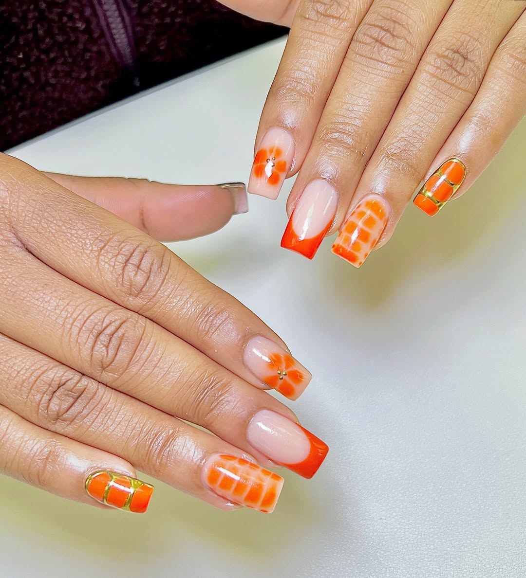 Bright Orange Square Tips with Checkered and Floral Accents