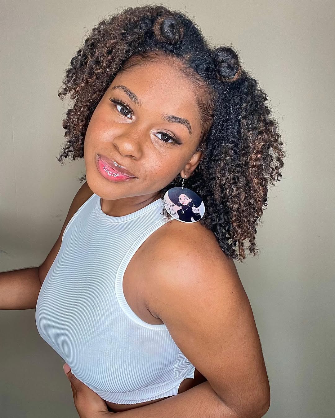 Caramel Highlights On Coily Half-Up Buns