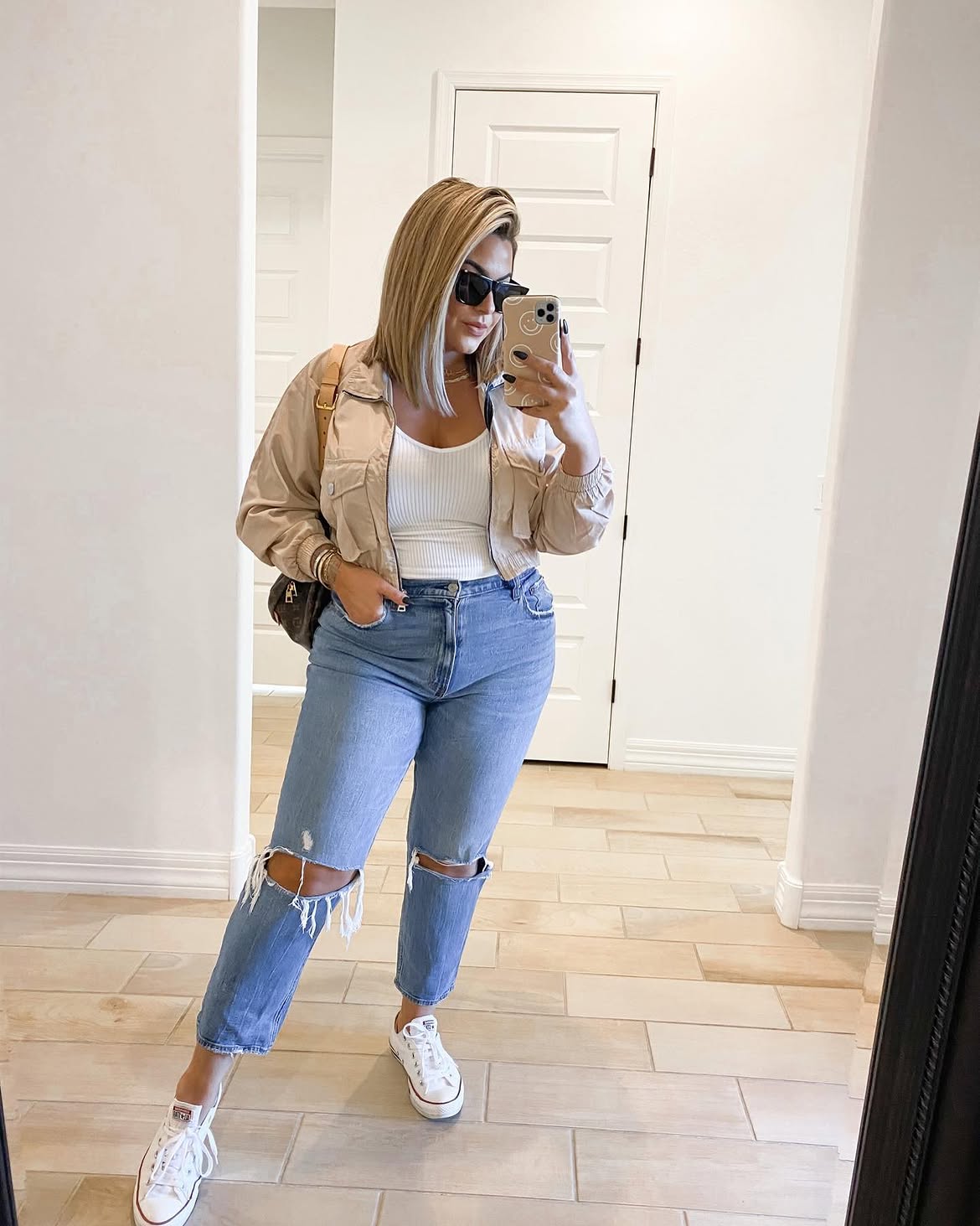 Casual Chic Cropped Bomber Jacket and Distressed Jeans