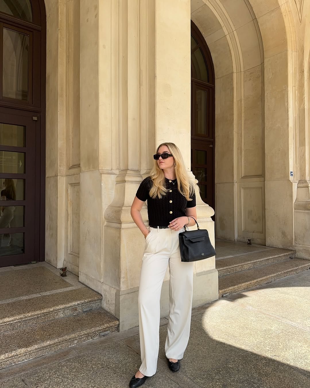 Chic Black Knit Top and Cream Wide-Leg Trousers