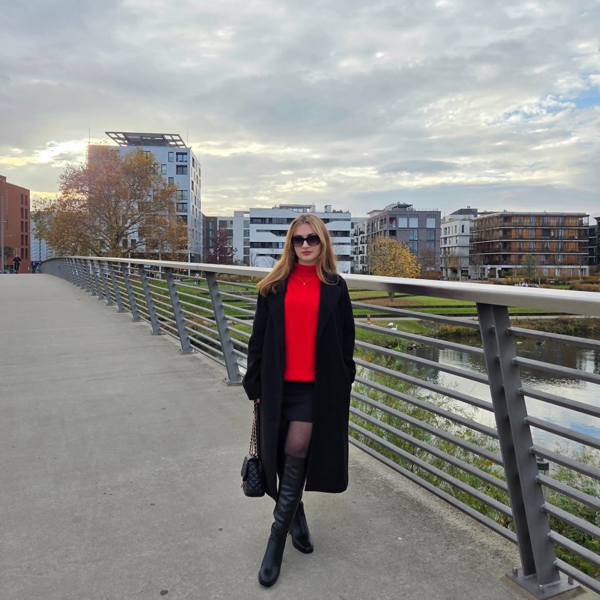 Chic Black Midi Coat With Red Turtleneck and Mini Skirt