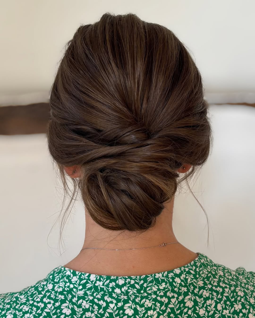 Chic Low Twisted Bun With Face Framing Wisps