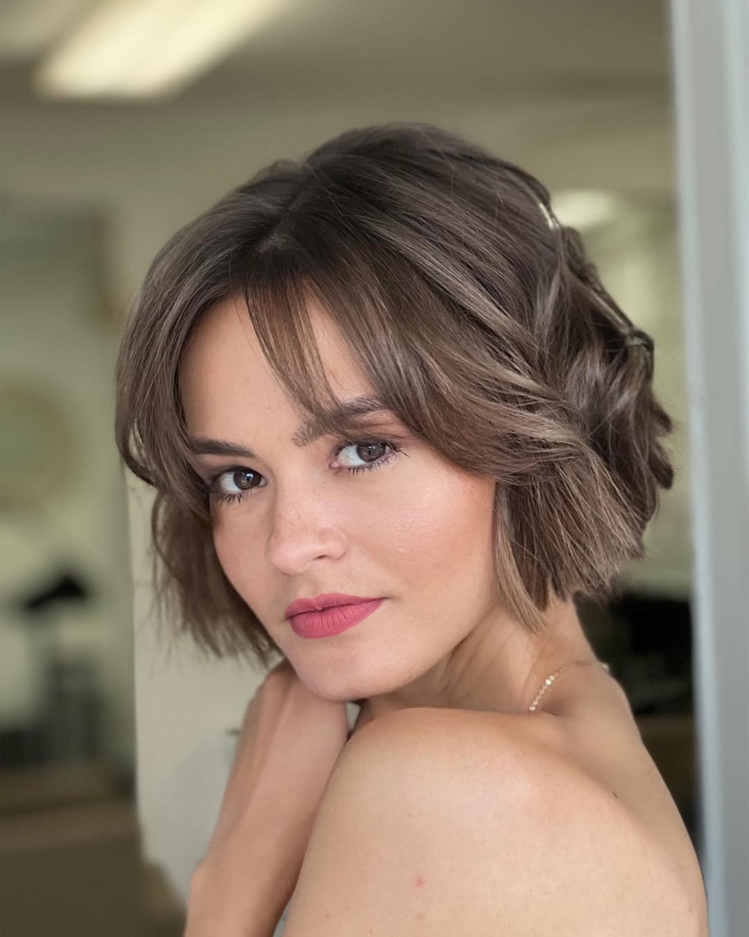 Chin-Length Wavy Bob With Wispy Bangs