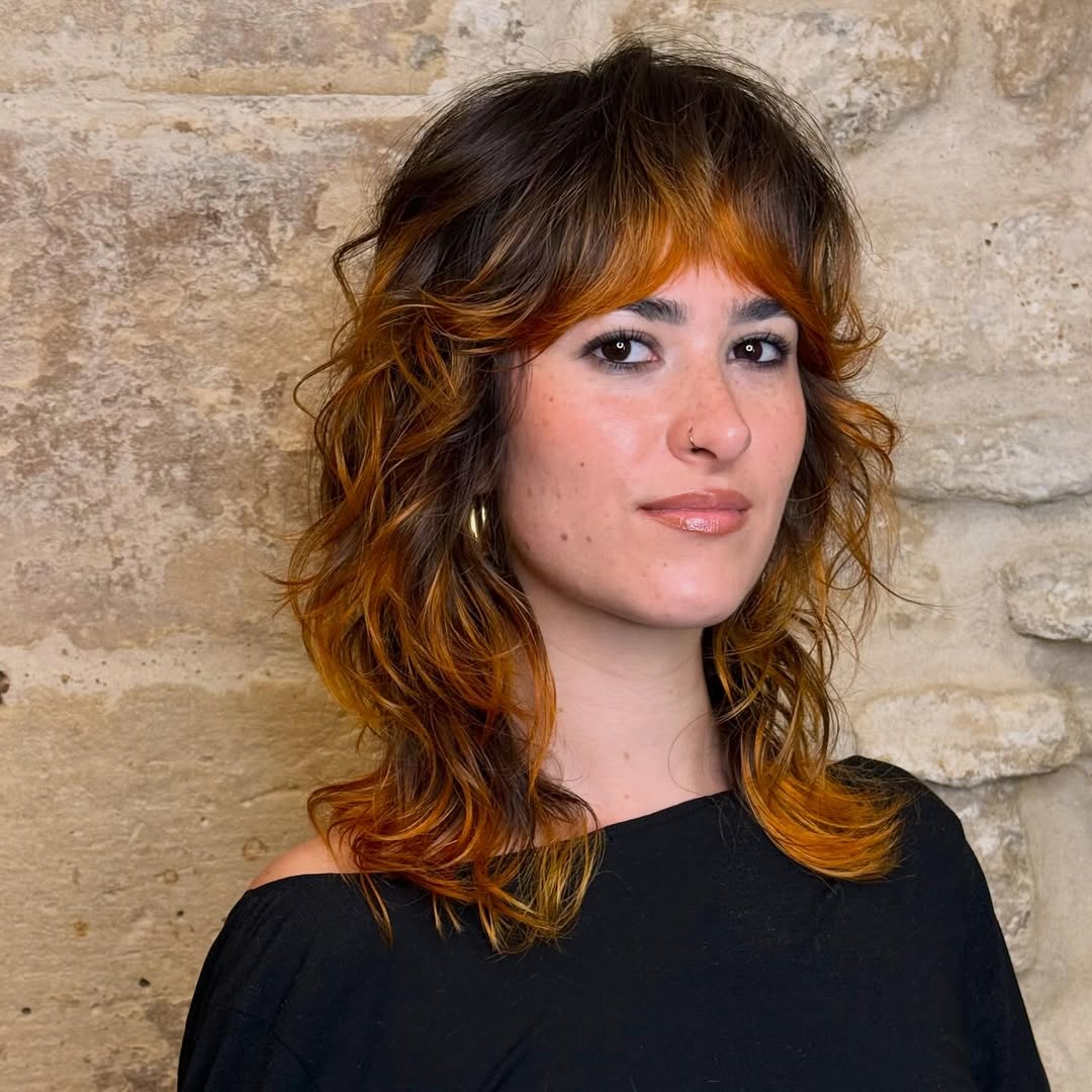 Choppy Shag With Auburn Highlights and Textured Bangs