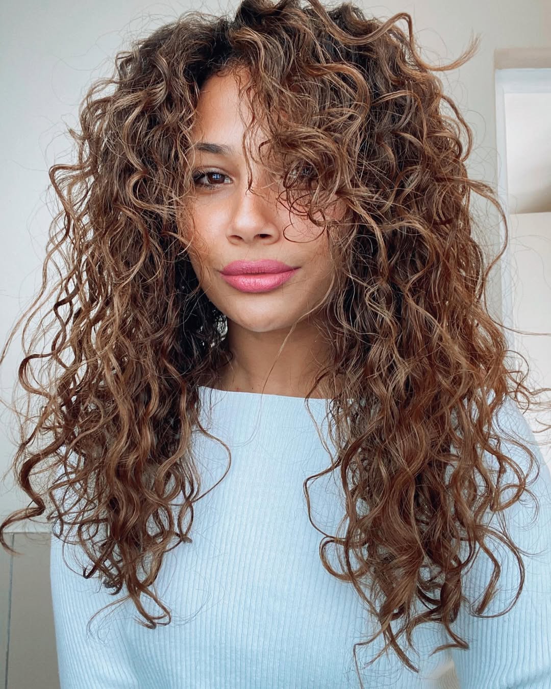 Defined Auburn Curls With Subtle Highlights