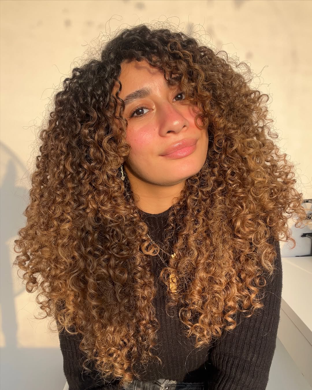 Defined Caramel Curly Layers With Dark Roots
