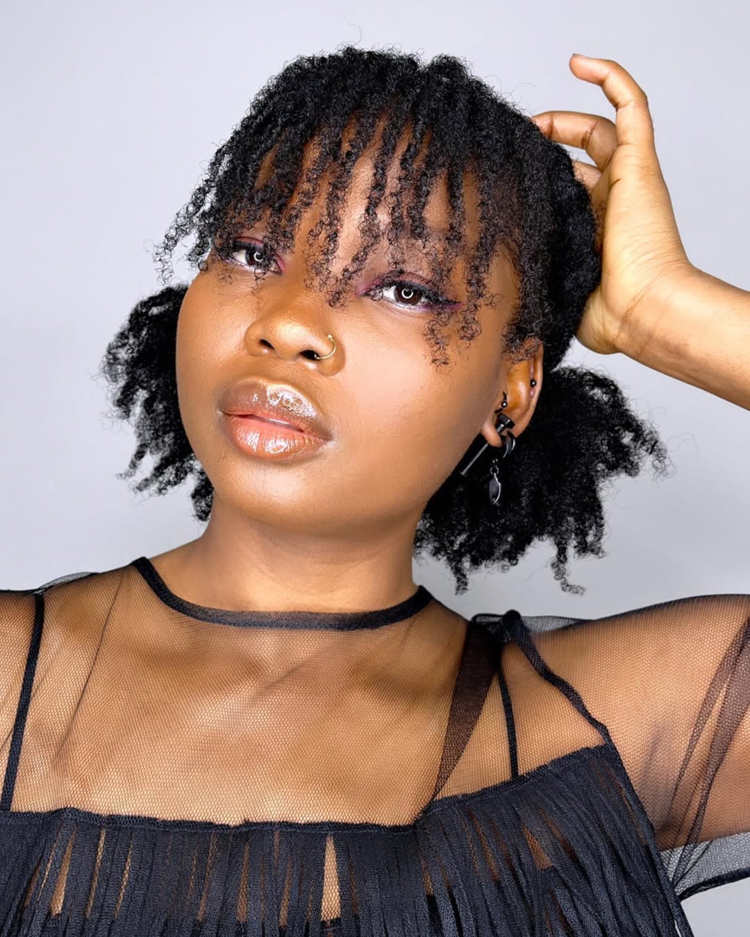 Defined Coily Bangs With Space Buns