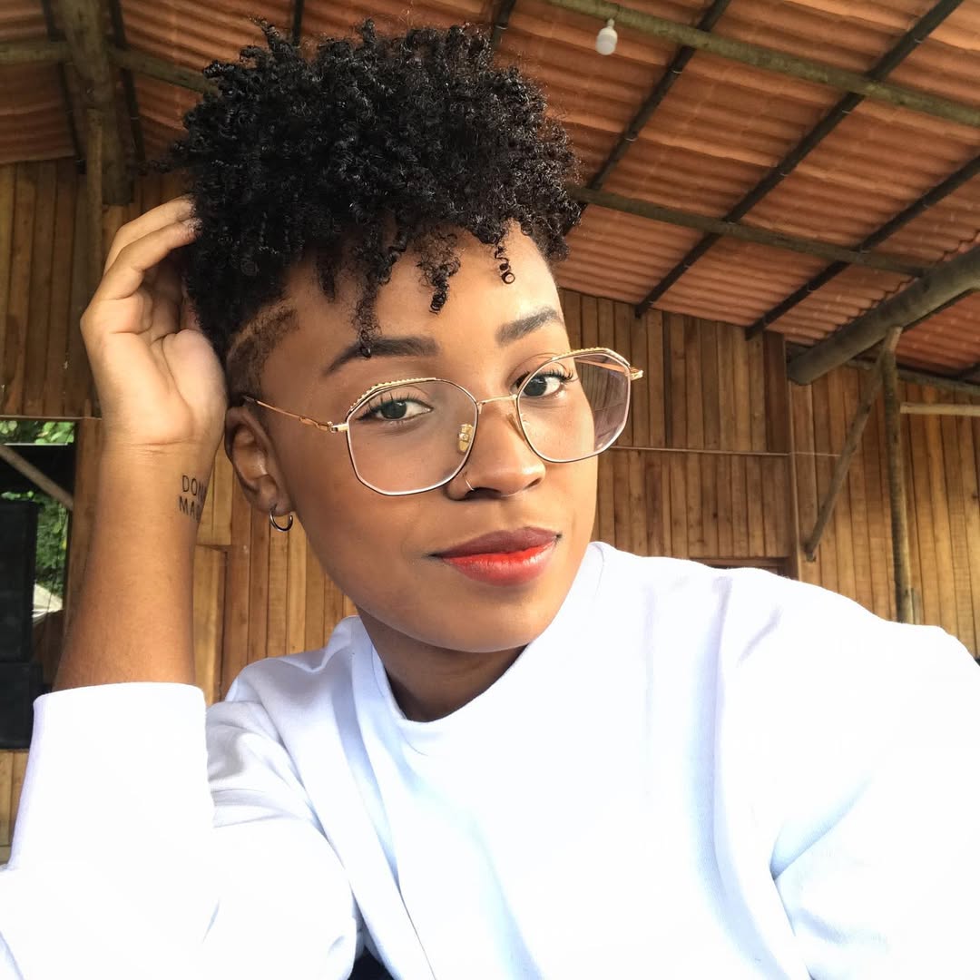 Defined Coily Pixie Tapered Haircut With Undercut