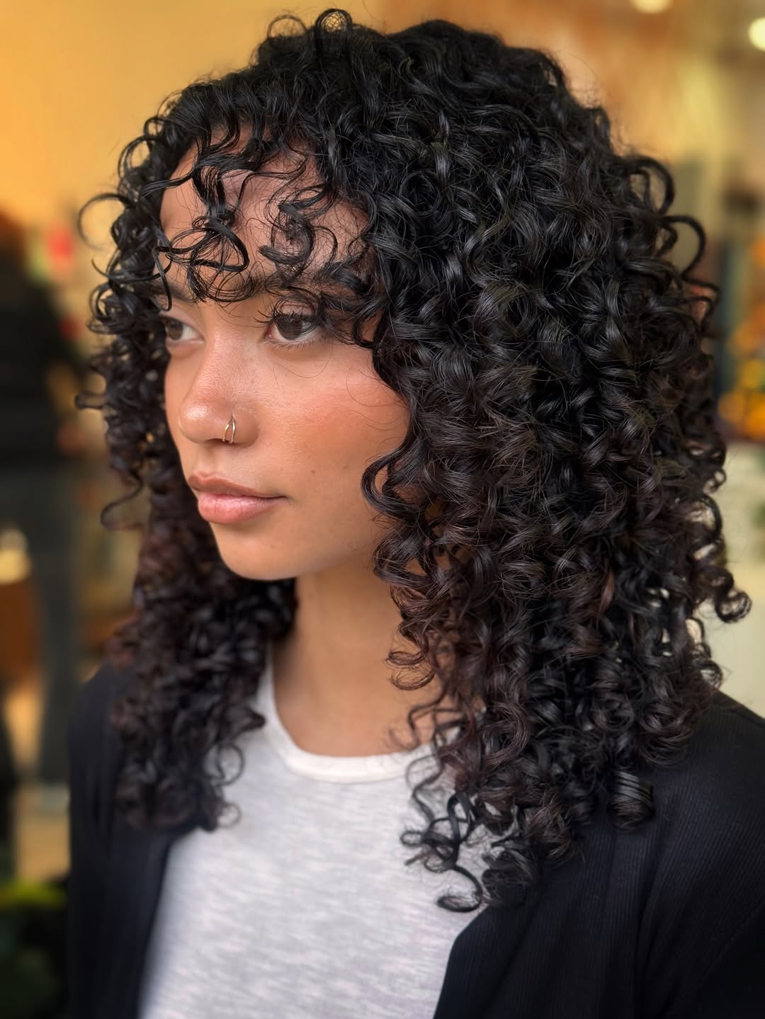 Defined Curly Lob With Wispy Bangs