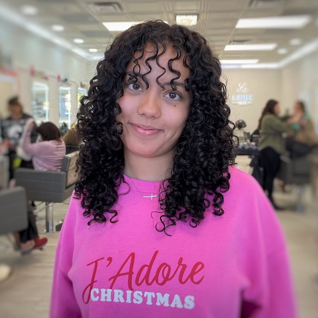 Defined Curly Lob With Wispy Curly Bangs