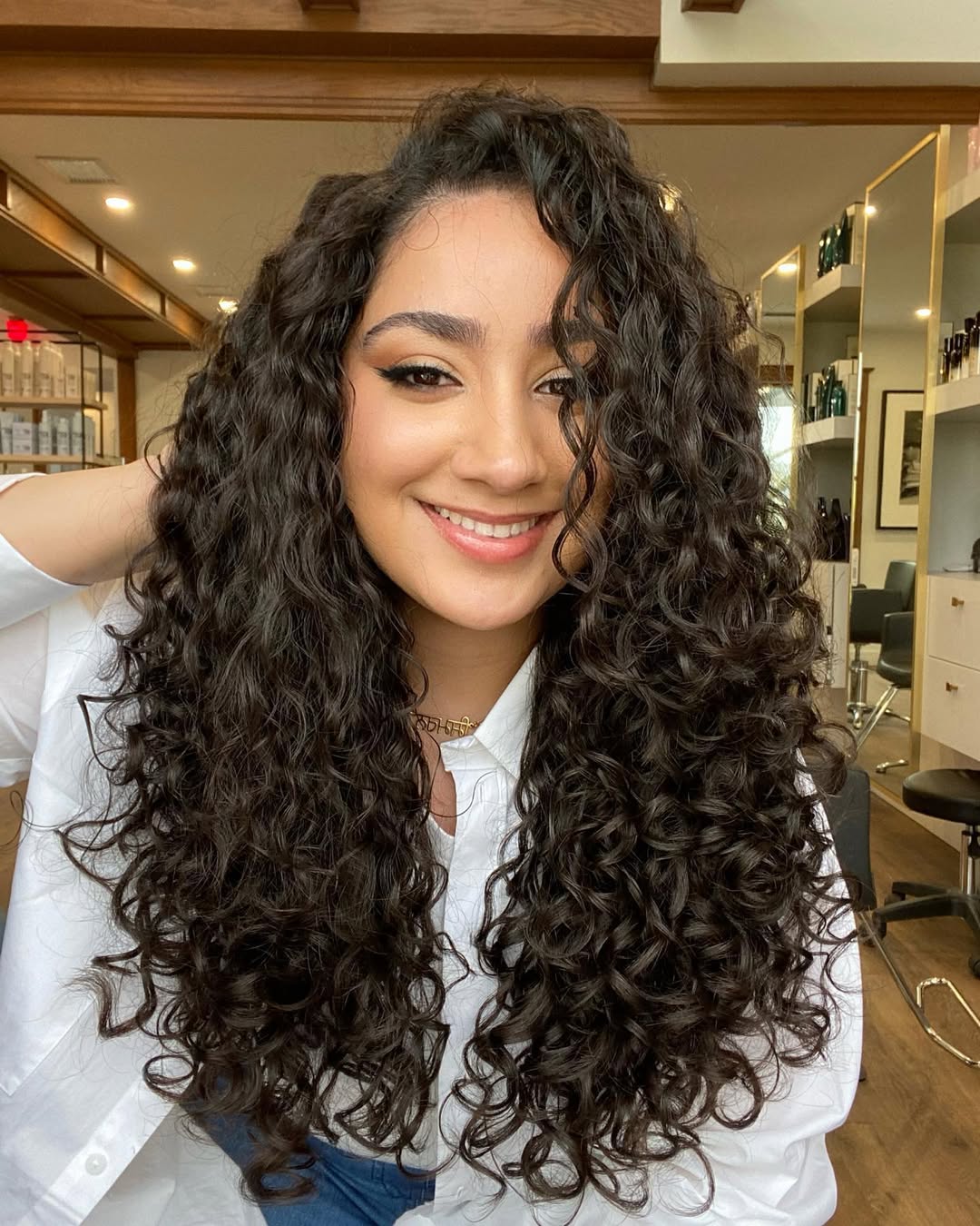 Defined Espresso Curls With Face Framing Layers