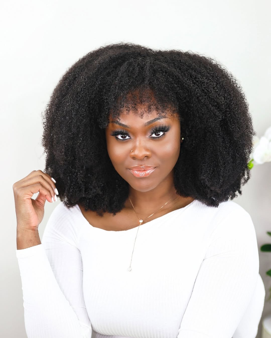 Defined Voluminous 4C Coils With Wispy Bangs