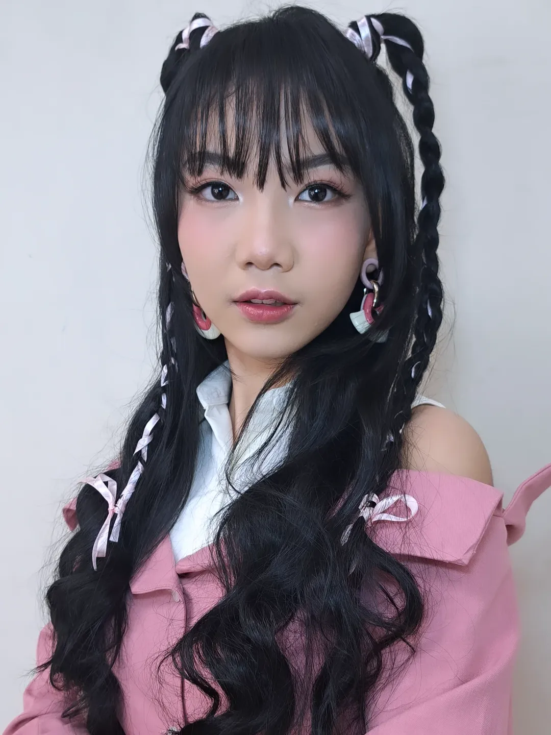Double Braided Pigtails With Pink Ribbon Accents