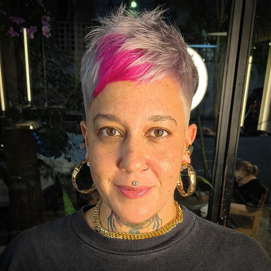 Edgy Asymmetrical Pixie With Bold Magenta Accents