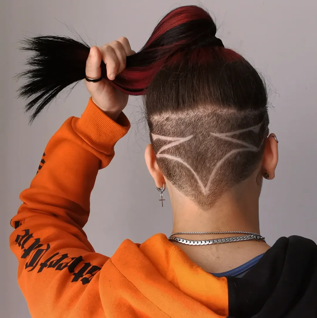 Edgy Undercut With Geometric Shaving and Cherry Red Accents