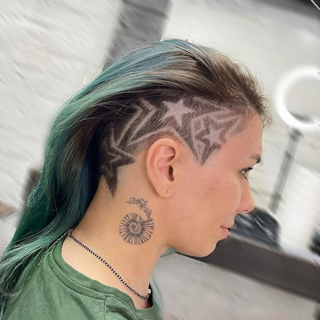 Edgy Undercut With Star Designs And Teal Highlights