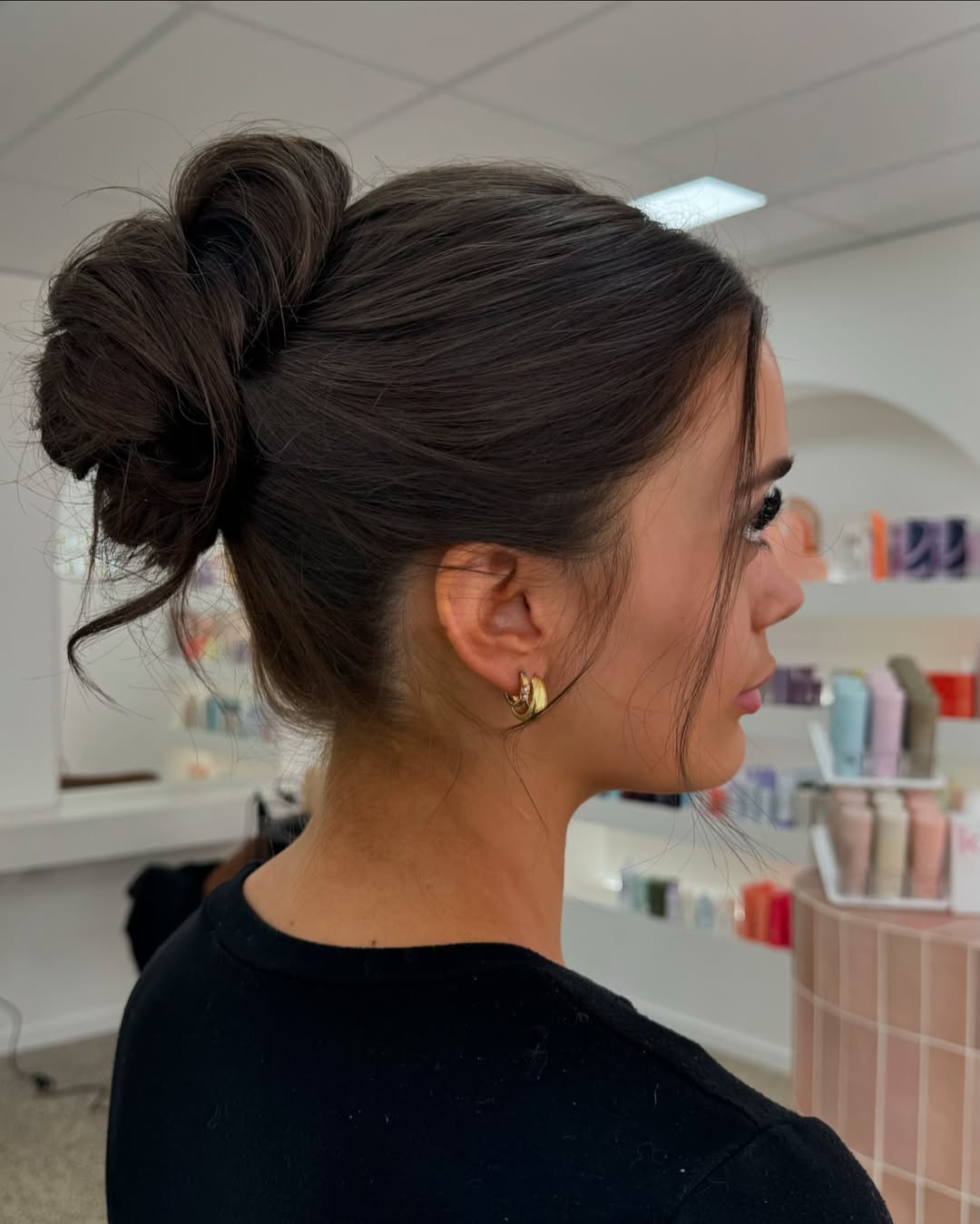 Effortless Messy High Bun With Face-Framing Strands