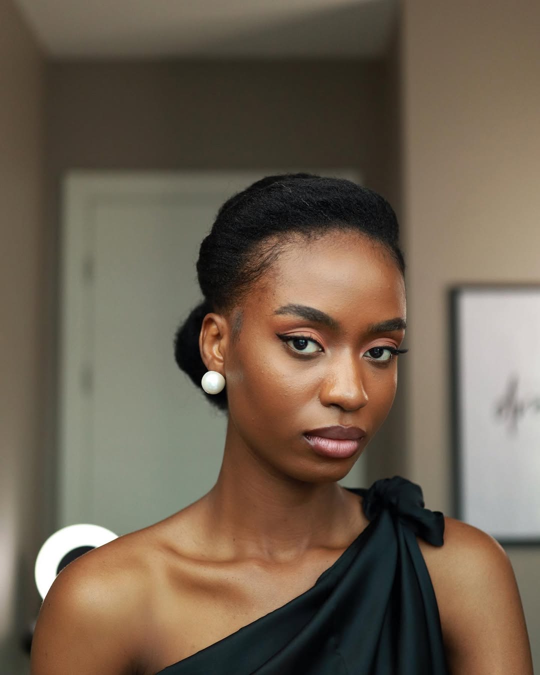 Elegant Coily Low Bun With Side Part