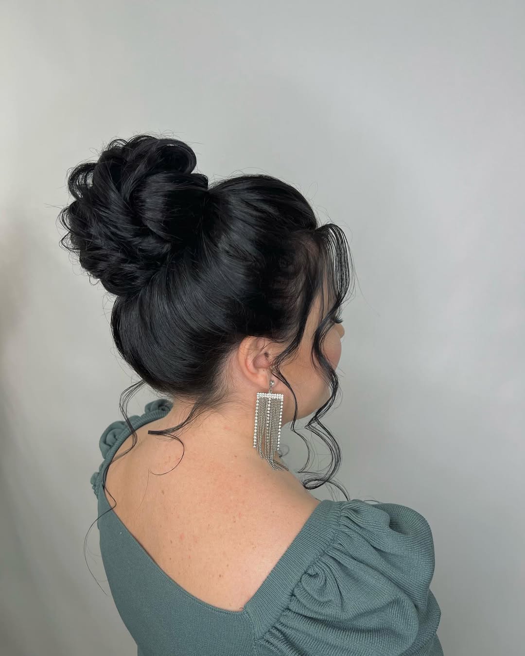 Elegant High Bun With Face Framing Waves
