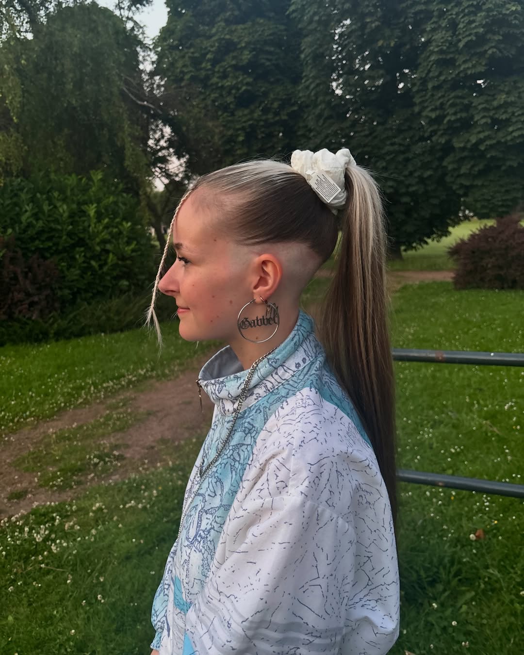 Extreme Undercut With High Ponytail And Face-Framing Tendril