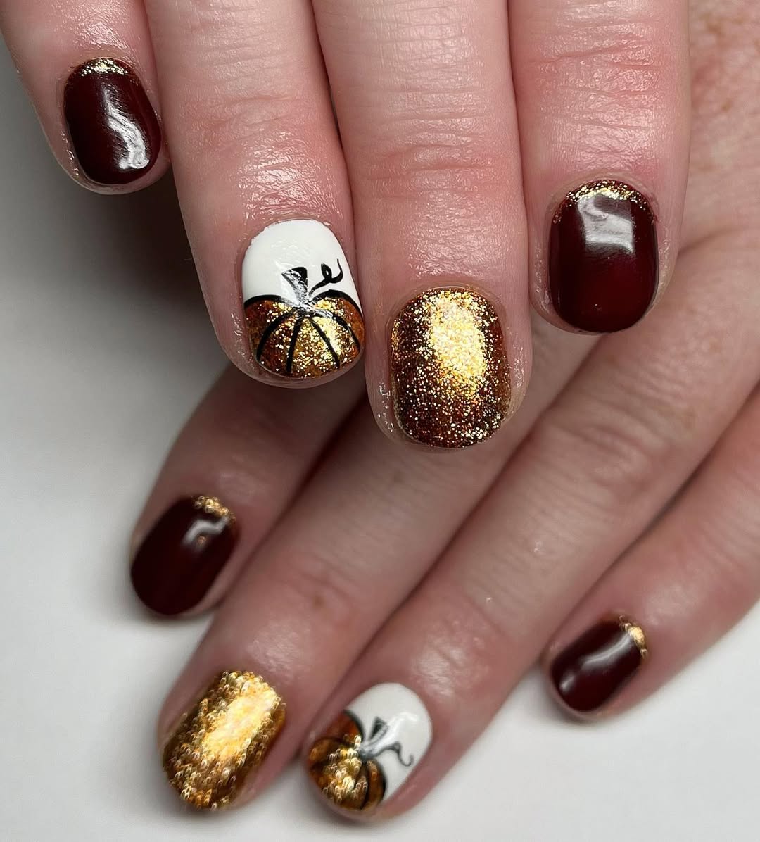 Festive Gold Glitter Pumpkin Nail Art
