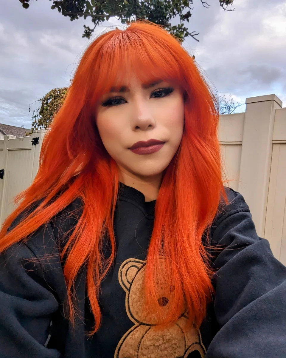 Fiery Orange Blunt Cut With Full Bangs