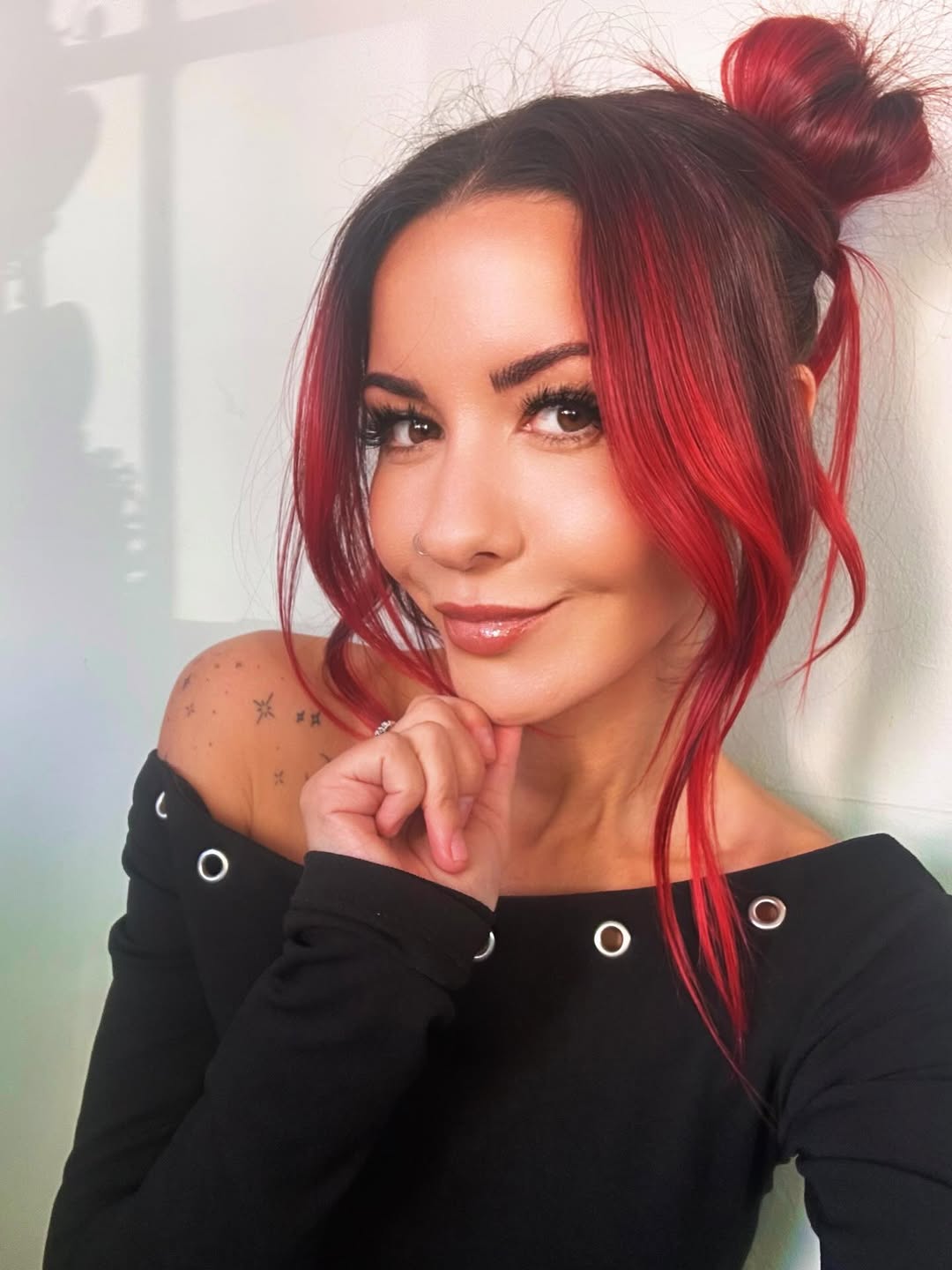 Fiery Red High Bun With Face-Framing Tendrils