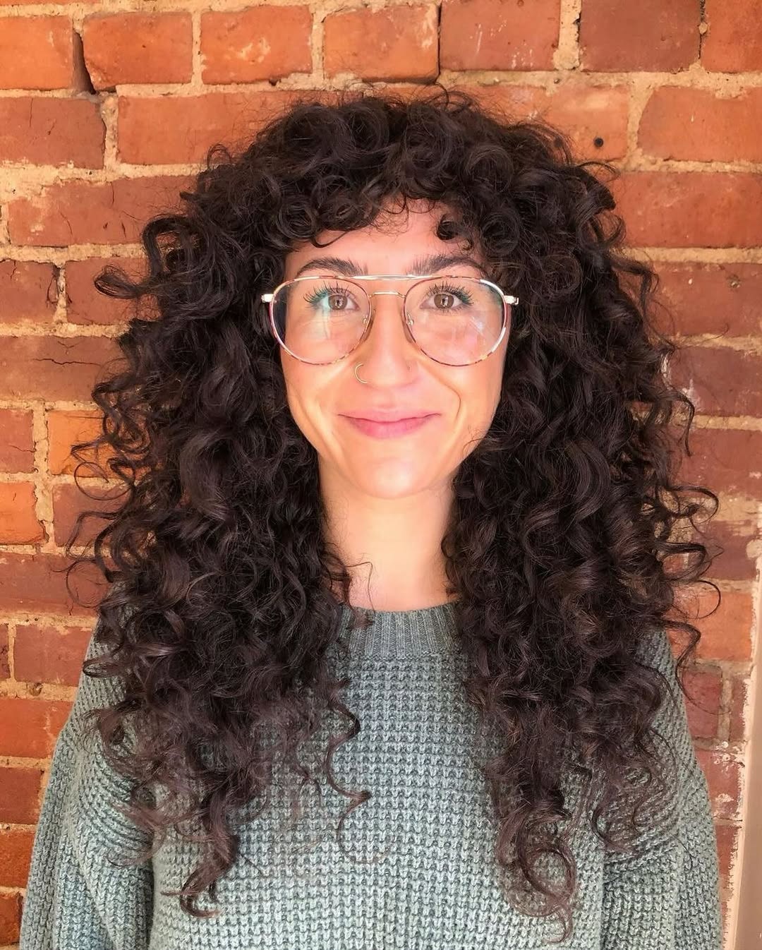 Full Curly Bangs With Layered Dark Brown Curls