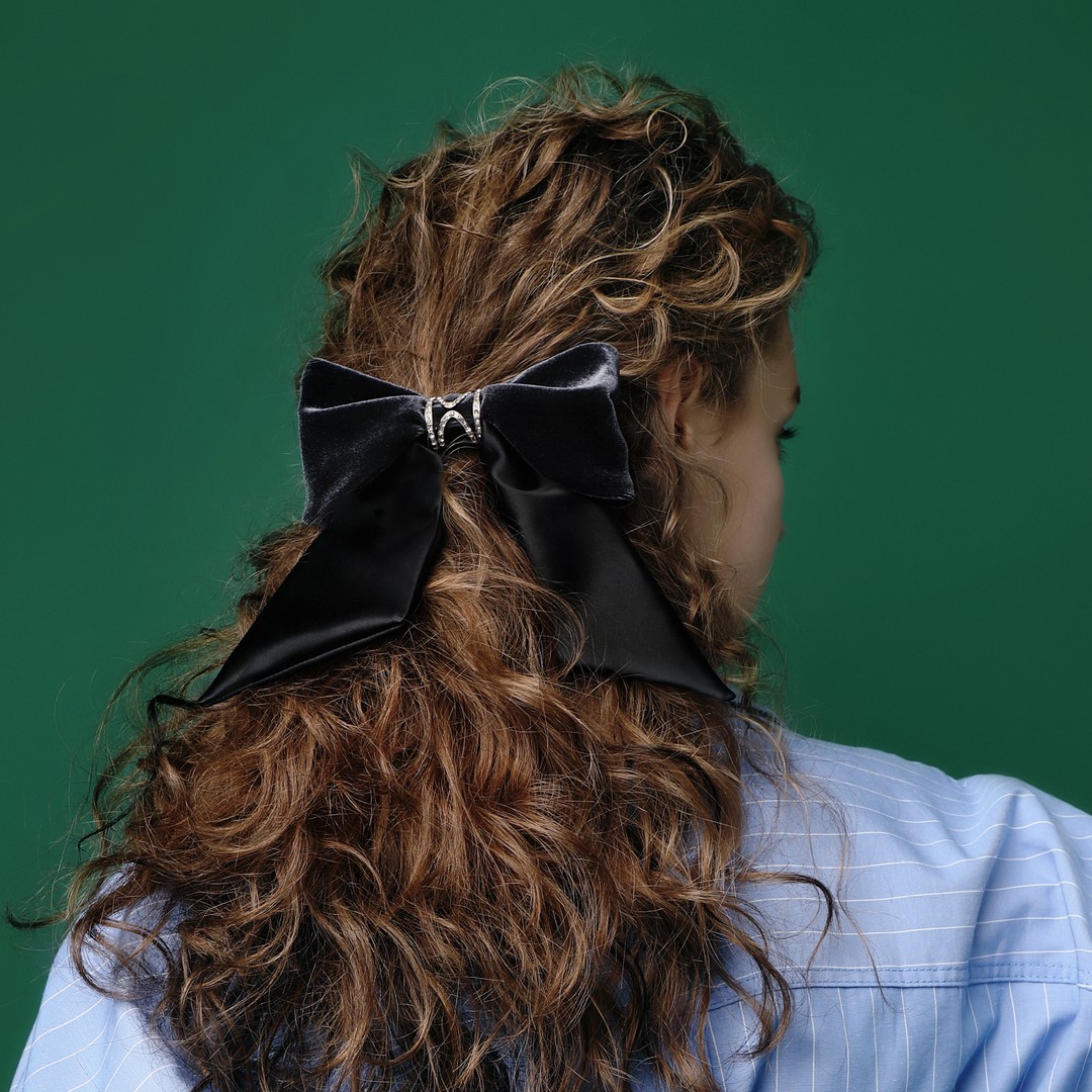 Glamorous Black Bow On Textured Copper Curls
