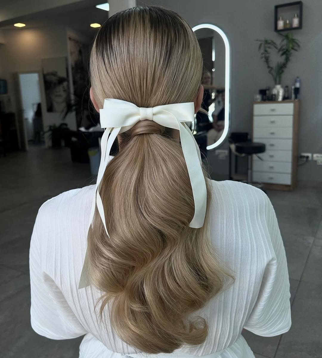 Glamorous Low Ponytail With Ribbon And Wavy Ends
