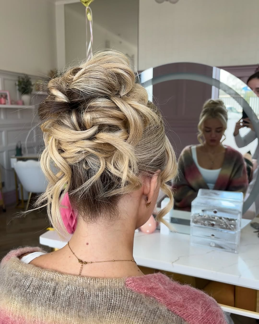 Glamorous Tousled High Bun With Face-Framing Tendrils