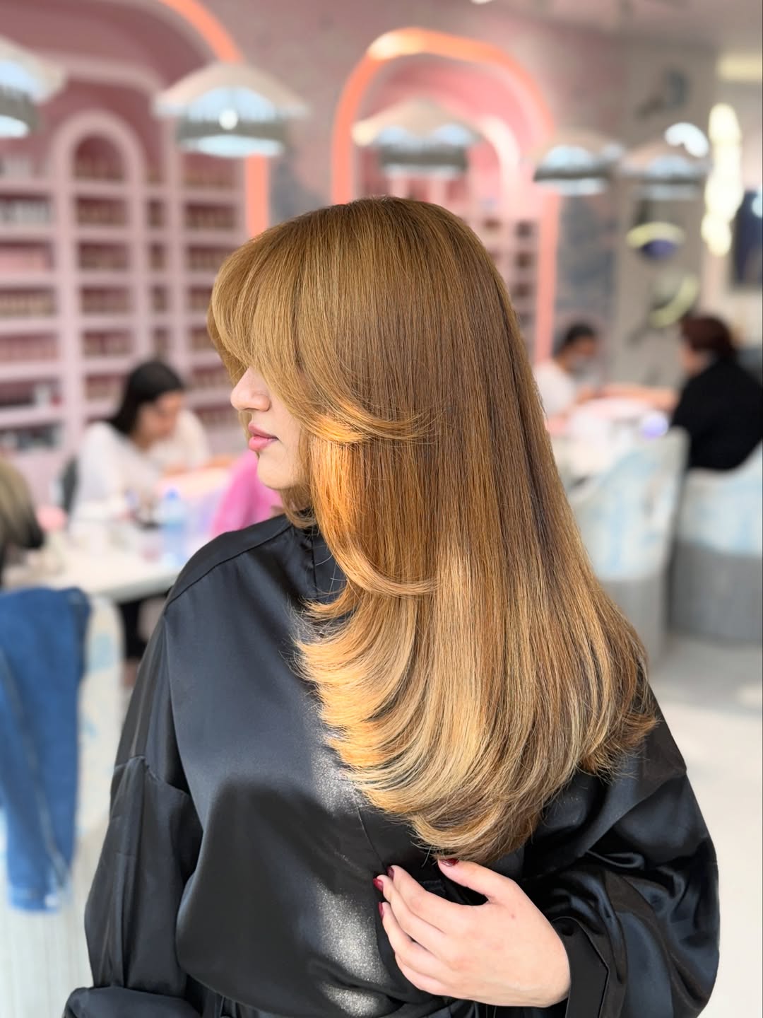 Golden Blonde Layered Cut With Face-Framing Bangs