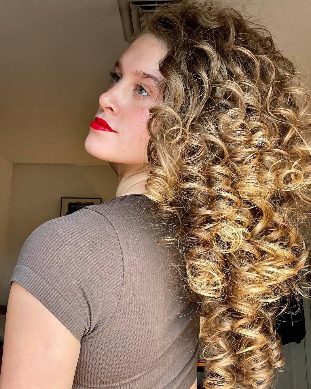 Golden Blonde Spiral Curls With Warm Highlights