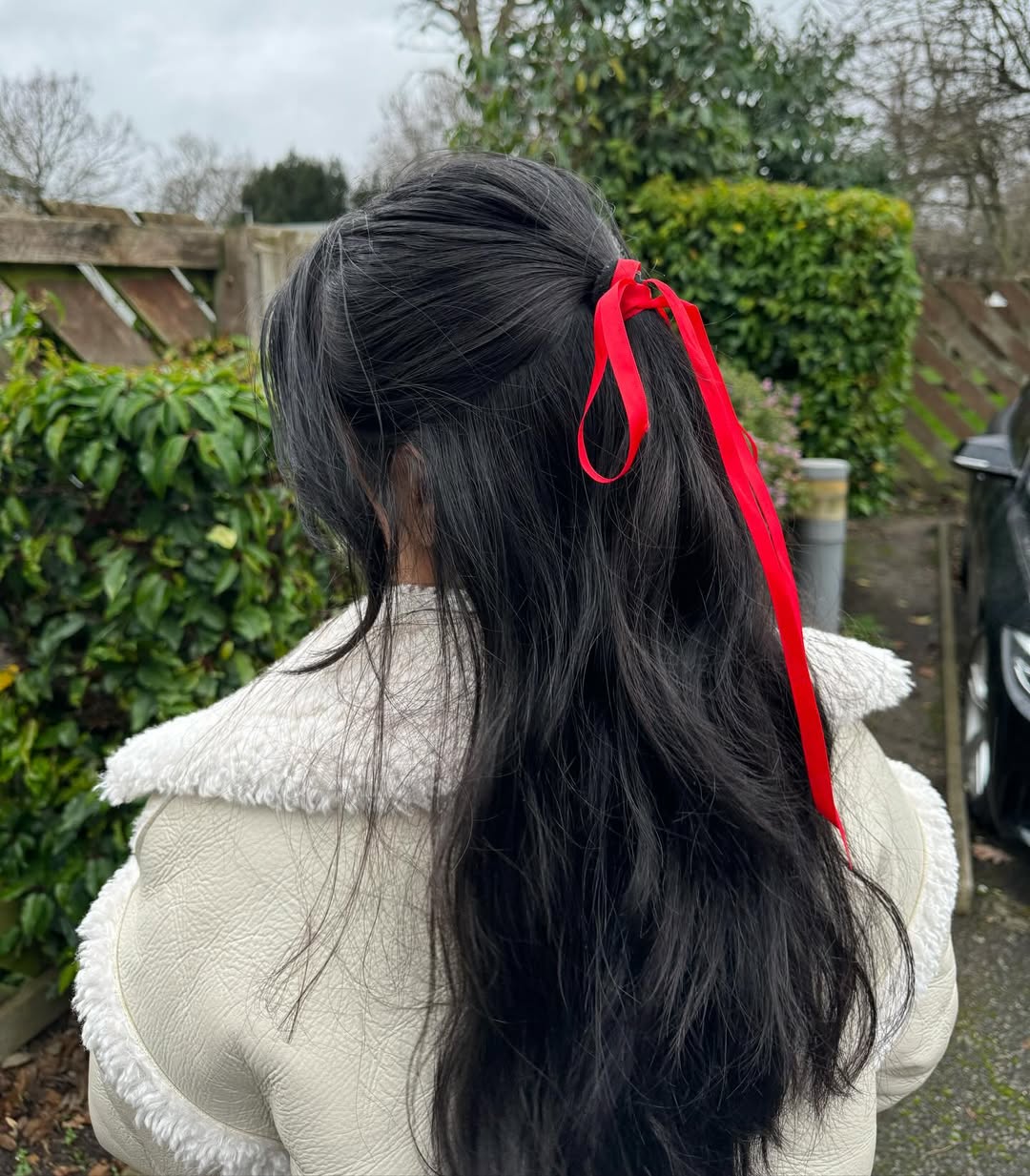 Half-Up Hair With Playful Red Ribbon