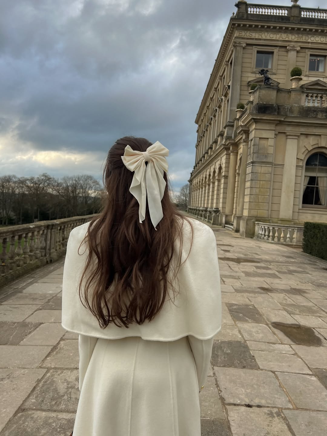 Half-Up Wavy Hair With Elegant Bow Accent
