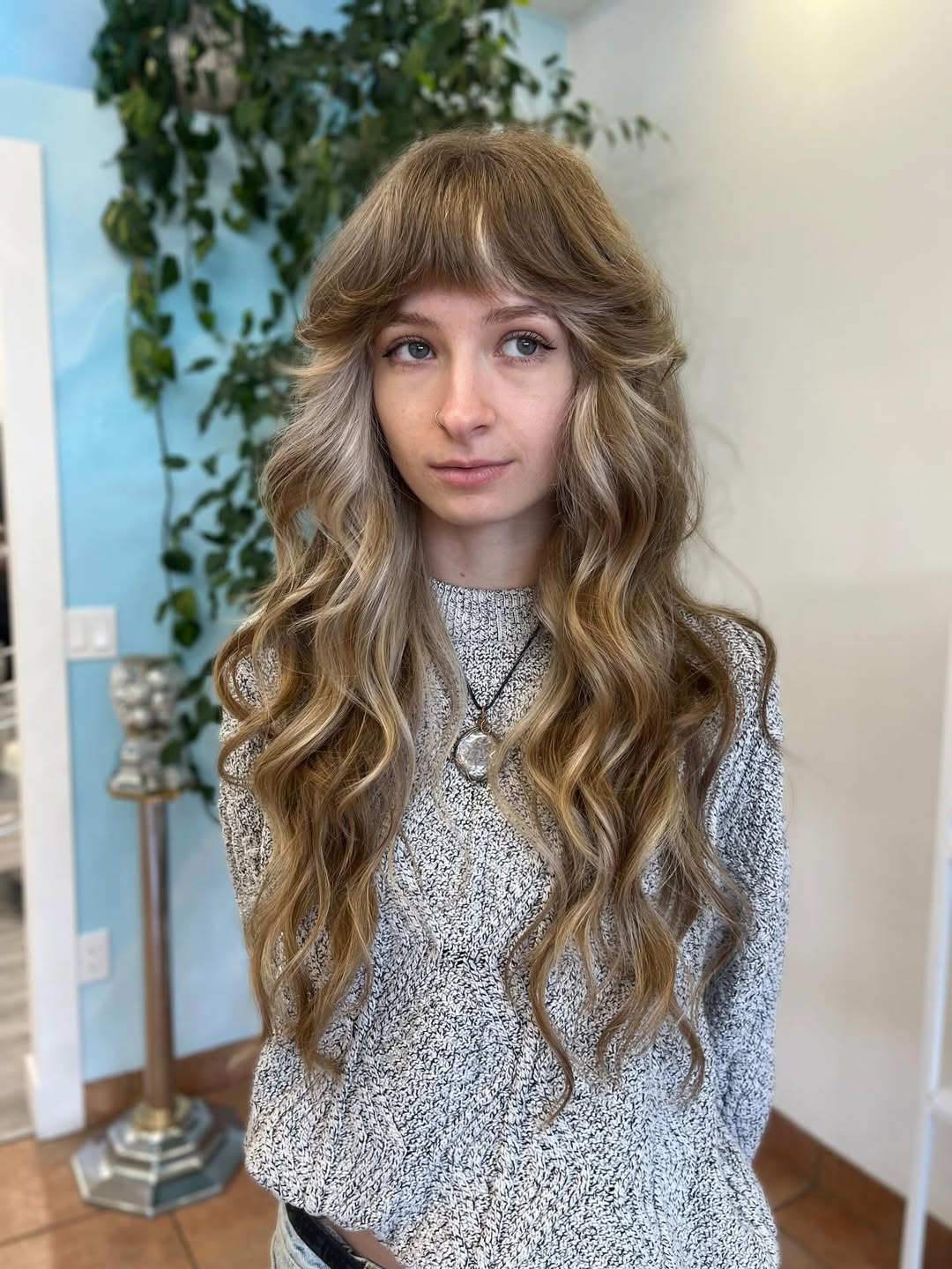 Honey Blonde Shag With Wavy Layers And Full Bangs
