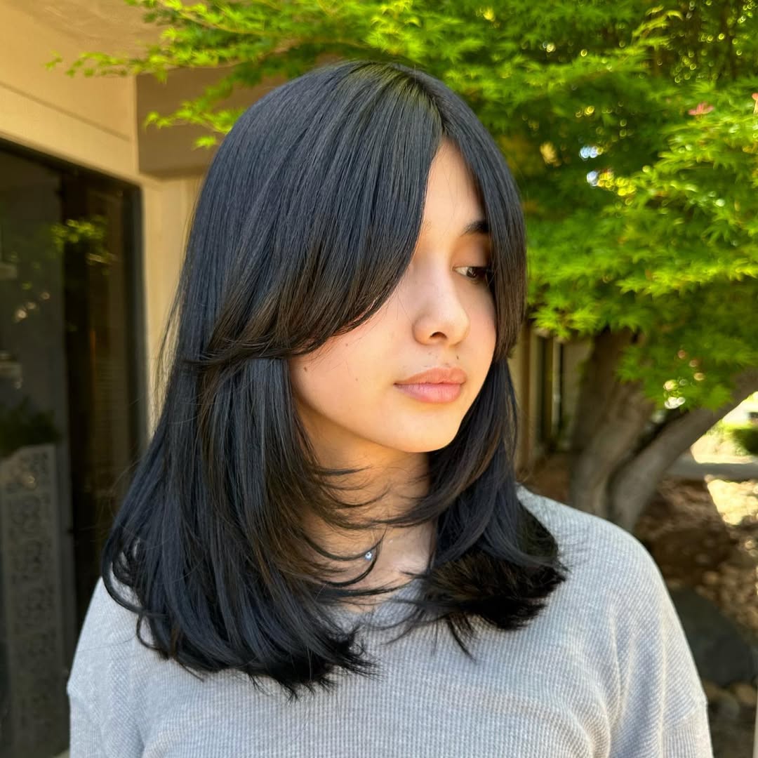 Layered Black Hair With Soft Curtain Bangs