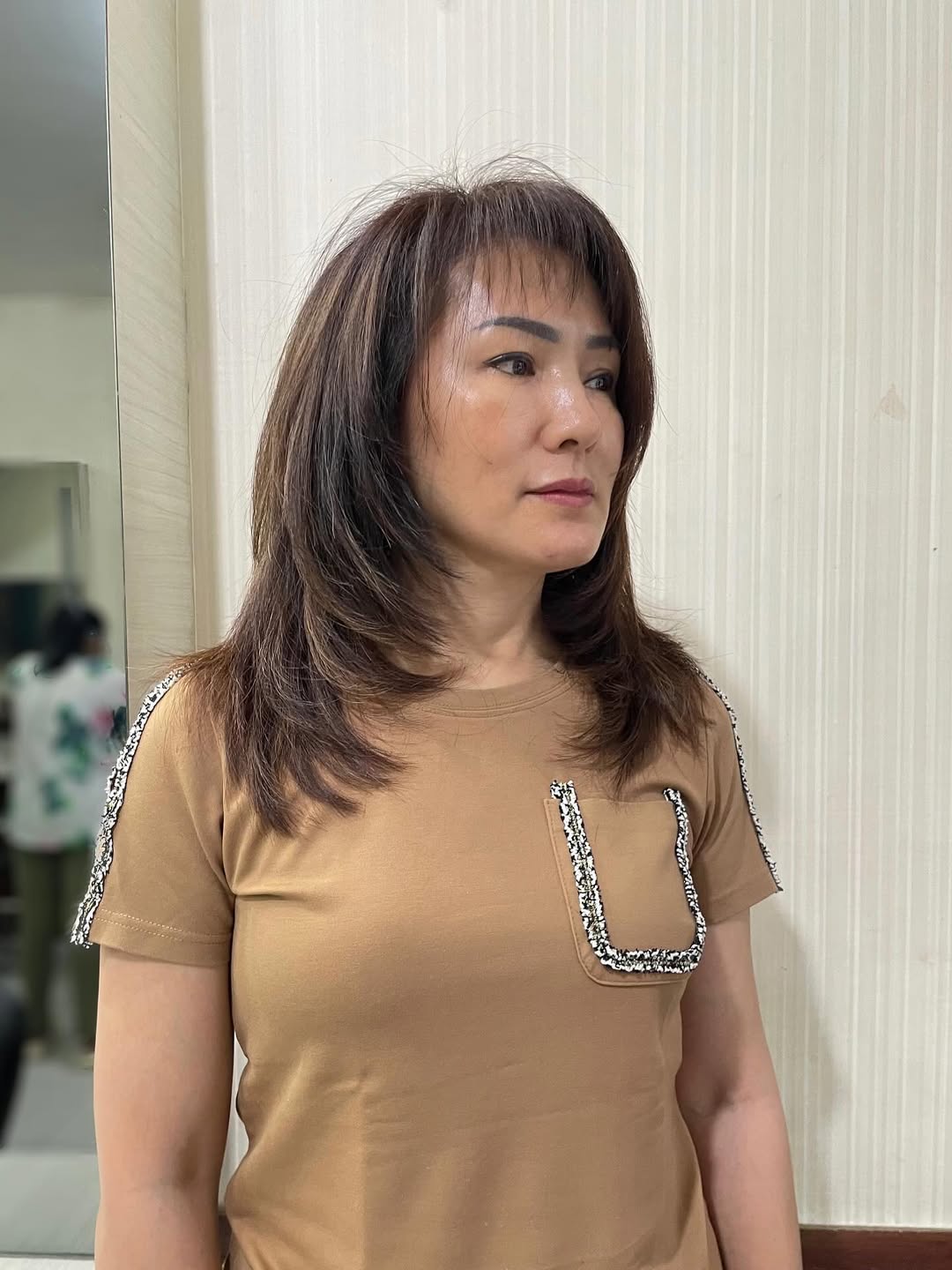Layered Shoulder-Length Cut with Wispy Fringe