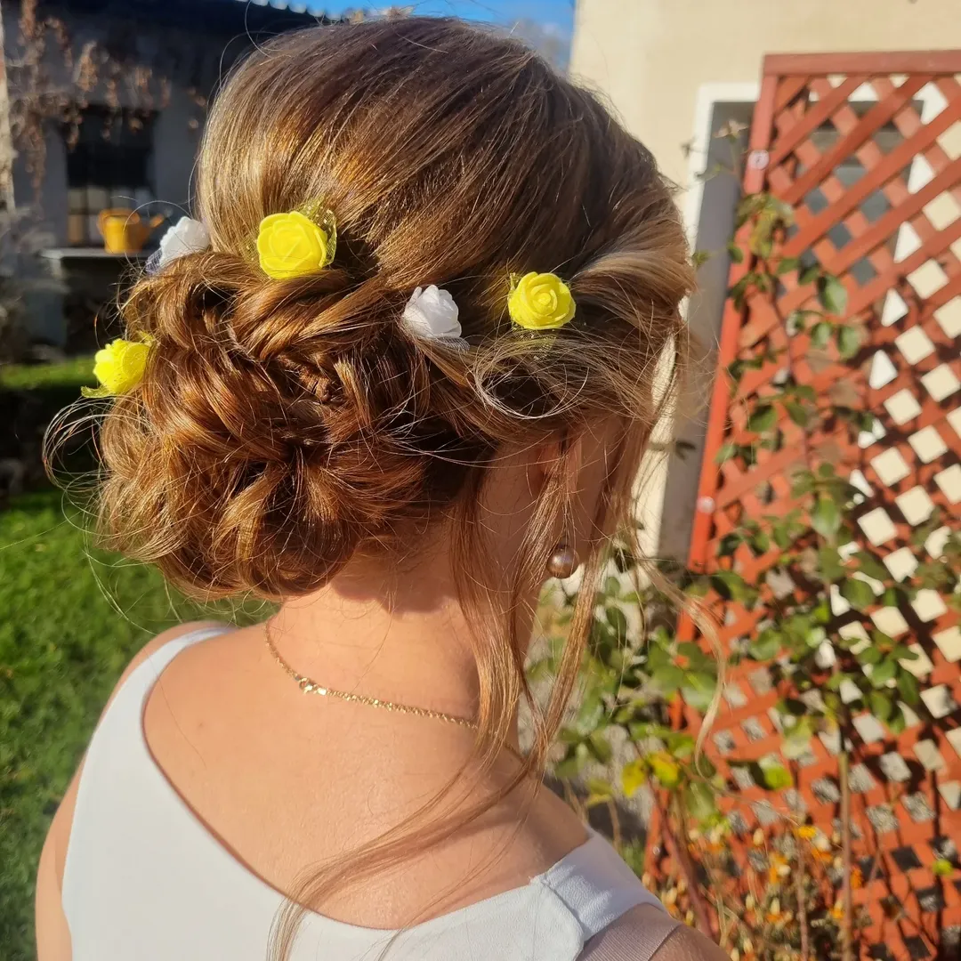Messy Braided Updo With Floral Embellishments