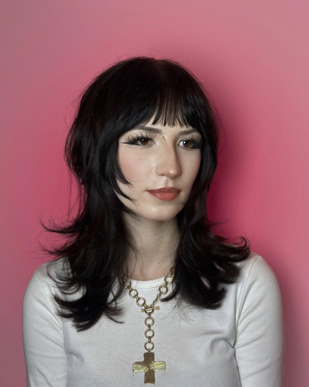 Modern Shag Haircut With Full Feathered Bangs