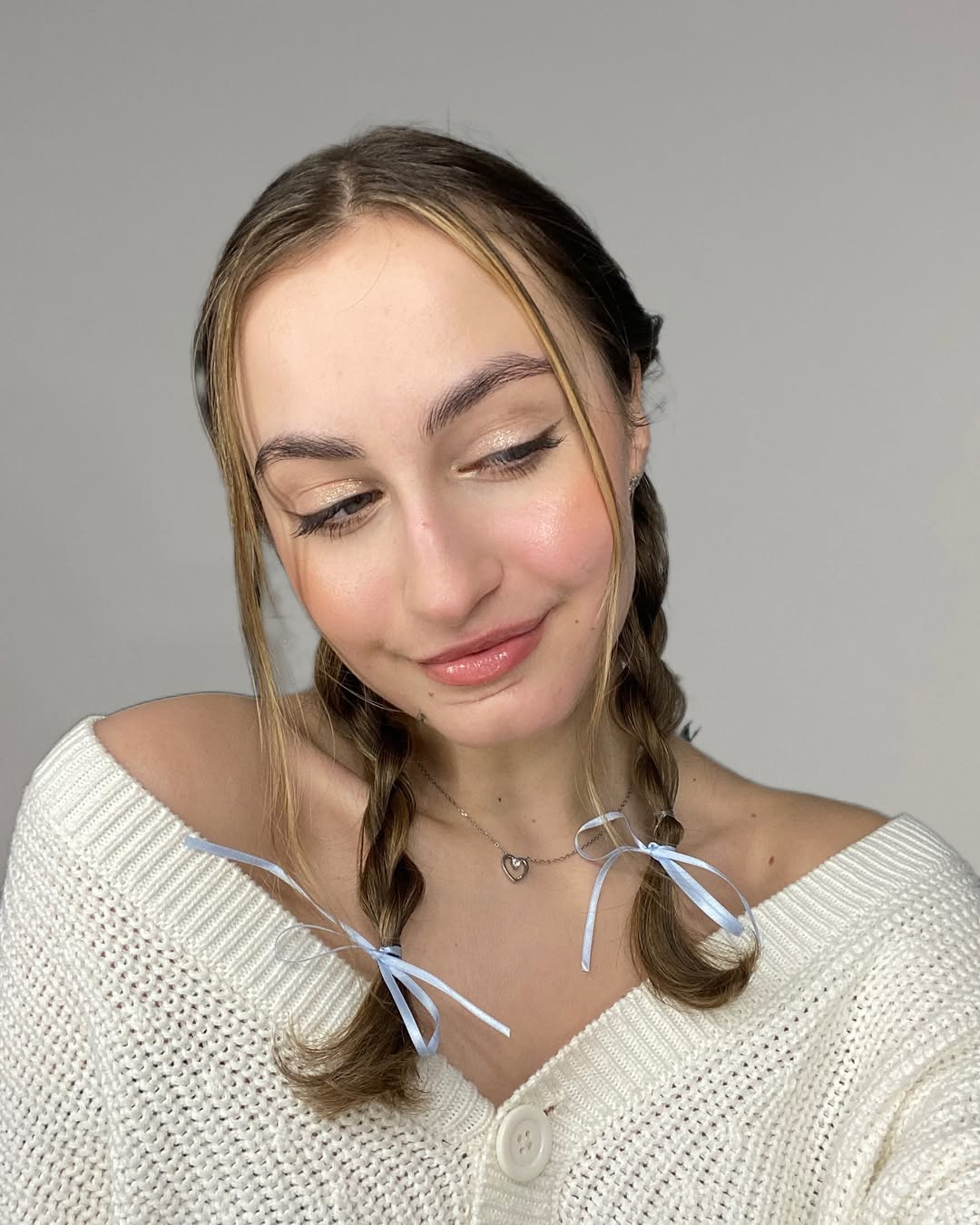 Pigtail Braids With Blue Ribbon Accents