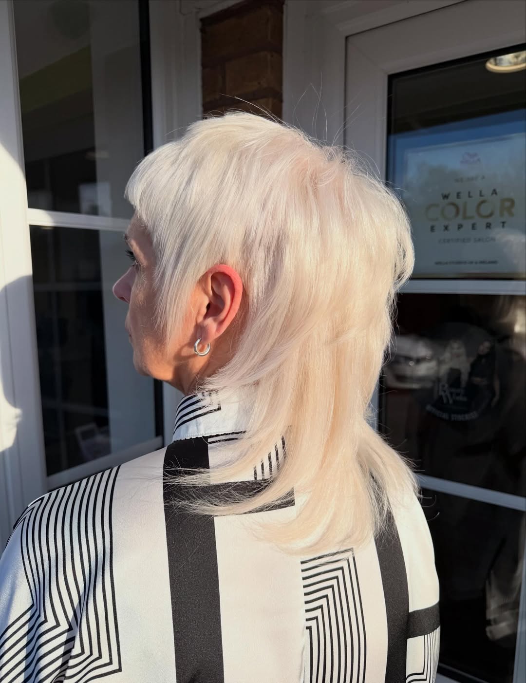 Platinum Blonde Shaggy Mullet With Short Bangs