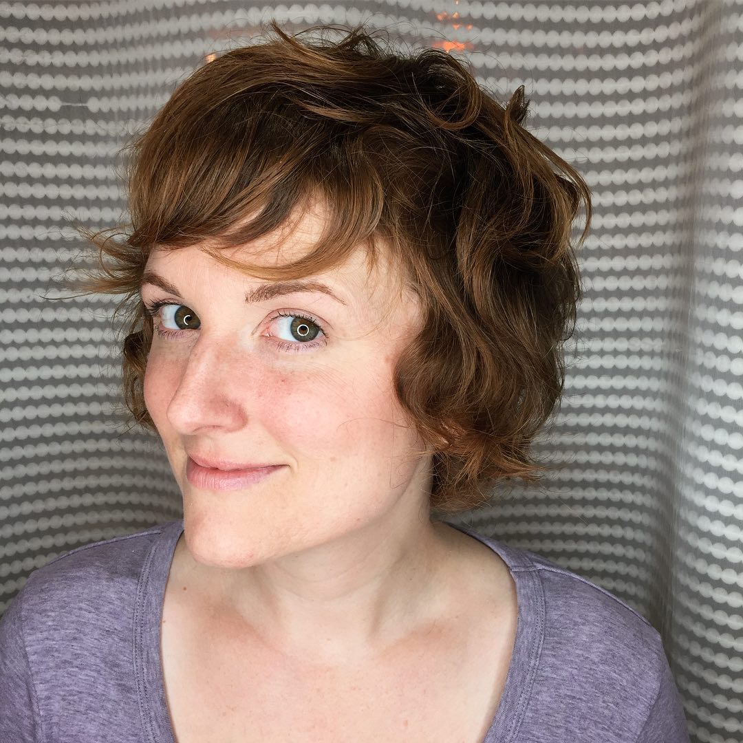 Playful Auburn Shaggy Bob With Wispy Bangs