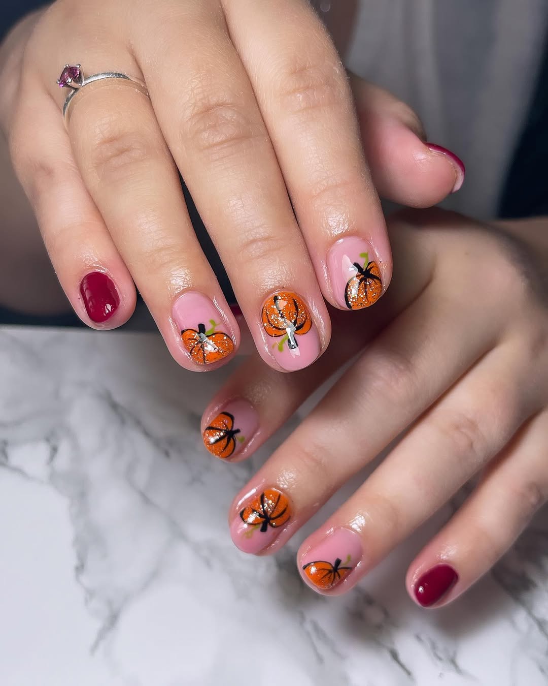 Playful Pink Pumpkin Nails with Glitter Accents