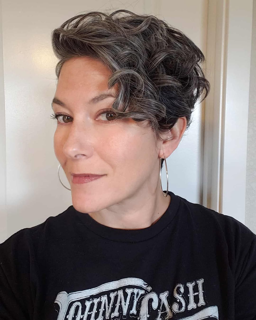 Playful Pixie Cut With Defined Gray Curls